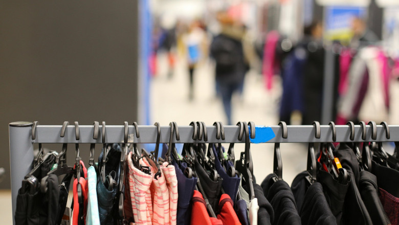 Details with clothes on hangers in a clothing store inside a shopping mall