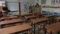 sala goala de clasa pe tabla e scris greva