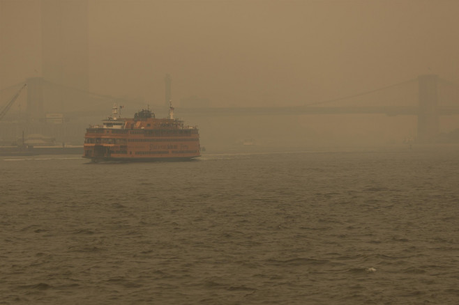The sun is seen in low visibility as smoke from the wildfires in Canada hits New York