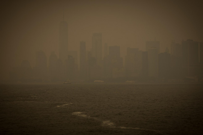 The sun is seen in low visibility as smoke from the wildfires in Canada hits New York