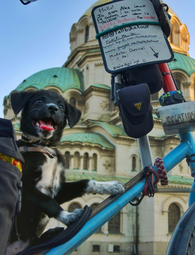 MAN AND DOG TRAVEL 7,000 MILES ACROSS THE WORLD ON A TALL BIKE