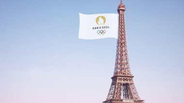 Olympic games flag on the Eiffel Tower In paris for PARIS 2024 - 3D rendering