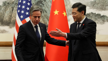 Secretary of State Antony Blinken (L) and China's Foreign Minister Qin Gang greet each other ahead of a meeting