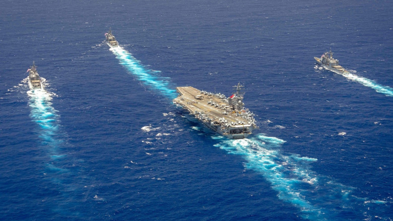 USS Ronald Reagan steams in formation with Ticonderoga-class guided-missile cruisers USS Antietam (CG 54), USS Robert Smalls (CG 62), and USS Shiloh (CG 67), attached to Carrier Strike Group (CSG) 5, in the Philippine Sea, June 3, 2023