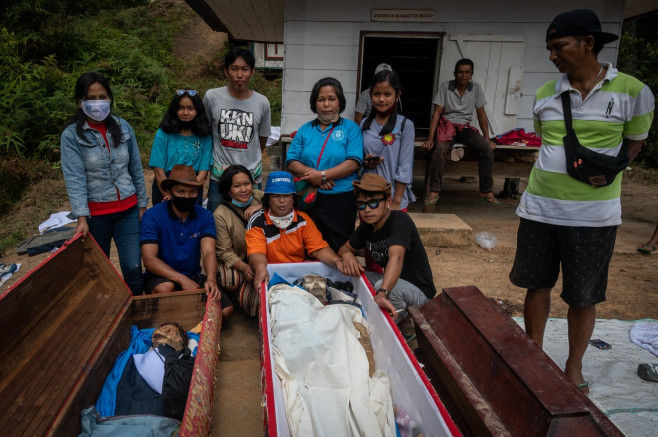 Family Members Perform Ma'nene Ritual To Honor The Spirits Of Their Mummified Ancestors