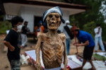 Family Members Perform Ma'nene Ritual To Honor The Spirits Of Their Mummified Ancestors