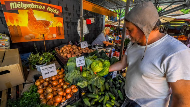 A customer shops for vegetables at the Bosnyak Market Hall in Budapest