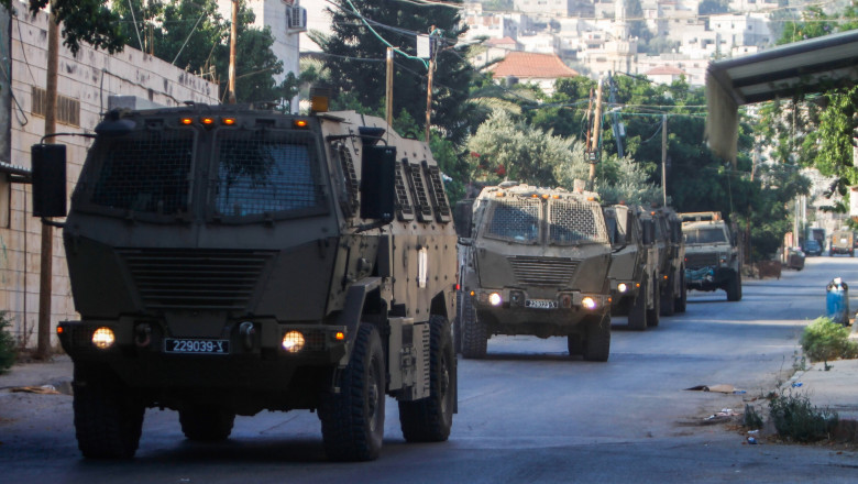 Israeli military reinforcements arrive at the Jenin refugee camp during a raid on the camp near the city of Jenin