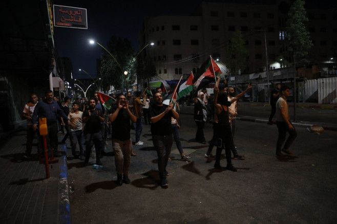 Palestinians shout slogans and hold placards during a demonstration in the West Bank city of Hebron protesting an Israeli military operation in Jenin for the second day, Hebron, West Bank, Palestinian Territory - 04 Jul 2023