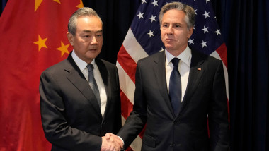 US Secretary of State Antony Blinken (R) shakes hands with Director of the Office of the Foreign Affairs Commission of the Communist Party of China's Central Committee Wang Yi