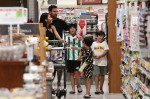 EXCLUSIVE: Lionel Messi and his wife Antonella start adjusting to life in America as they take their three sons to a Miami supermarket