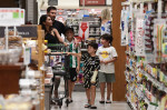 EXCLUSIVE: Lionel Messi and his wife Antonella start adjusting to life in America as they take their three sons to a Miami supermarket