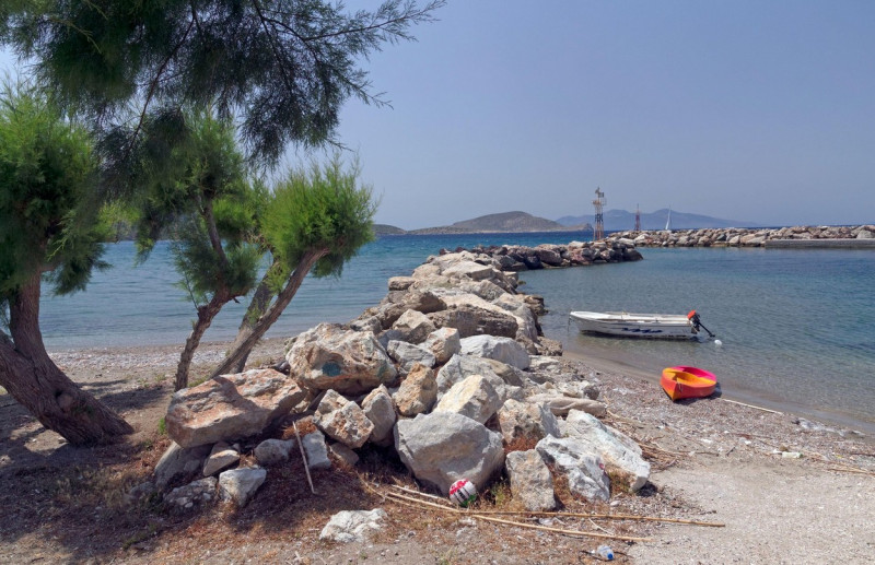 Canoe/kayak. boat / boats at the harbour wall at Agios Antonios,Tilos, Dodecanese, Greece. May 2022.. Spring