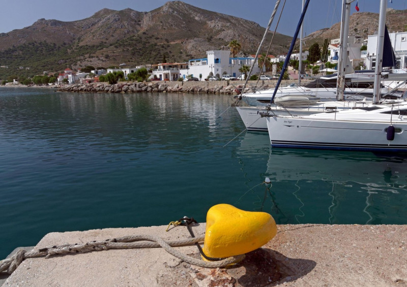 Boats moored at Livadia harbour, Tilos island, Dodecanese, Greece