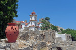 Agia Zoni Church, Mikro Horio, Tilos, Dodecanese islands, Southern Aegean, Greece; with pretty terracotta urn in foreground. Tilos, Greece