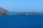 Small islet (Gaidaros) just off Tilos island Dodecanese, Greece, EU.cym