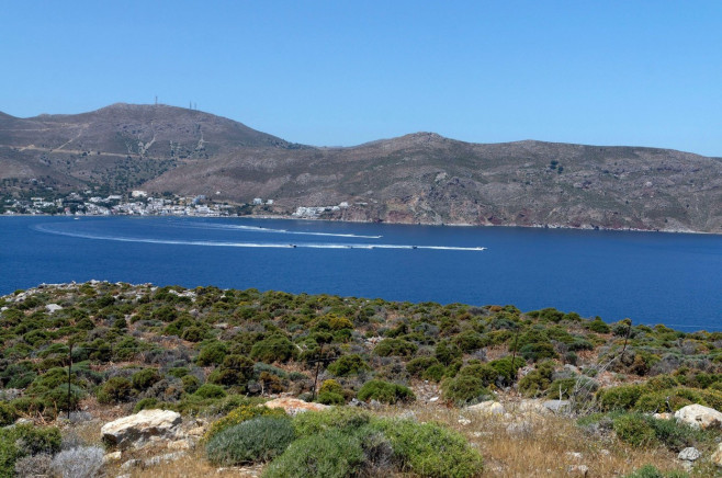 High powered boats in formation racing around Livadia Bay. Tilos island, Dodecanese, Greece, EU