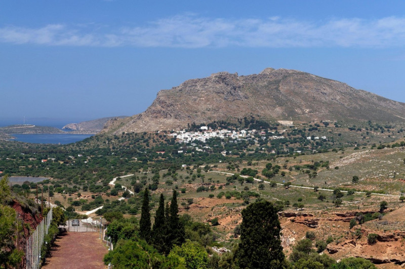 Megalo Chorio village on the side of hill, as seen from across the valley.at the elephant cave, Tilos.