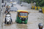 GURUGRAM, INDIA - JULY 9: Vehicle wades through a waterlogged stretch after heavy monsoon rains at sohna road near Islam