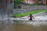 NEW DELHI, INDIA - JULY 9: Commuters moves from heavily water logged Bhairav Marg underpass after monsoon rains on July