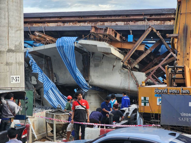Driver and passenger crushed to death when bridge collapses on their car in Thailand