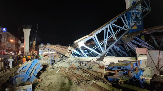 Driver and passenger crushed to death when bridge collapses on their car in Thailand