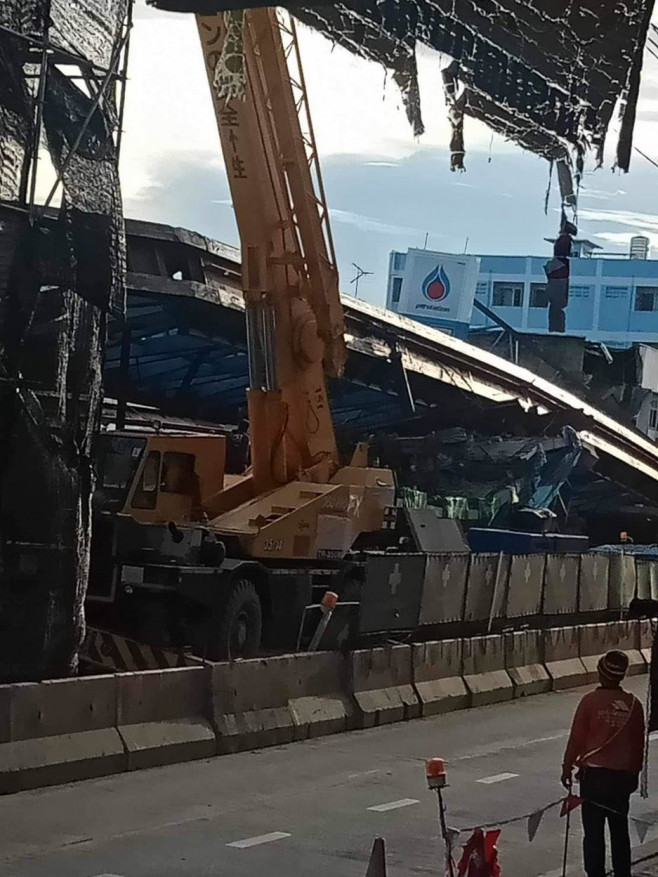 Driver and passenger crushed to death when bridge collapses on their car in Thailand