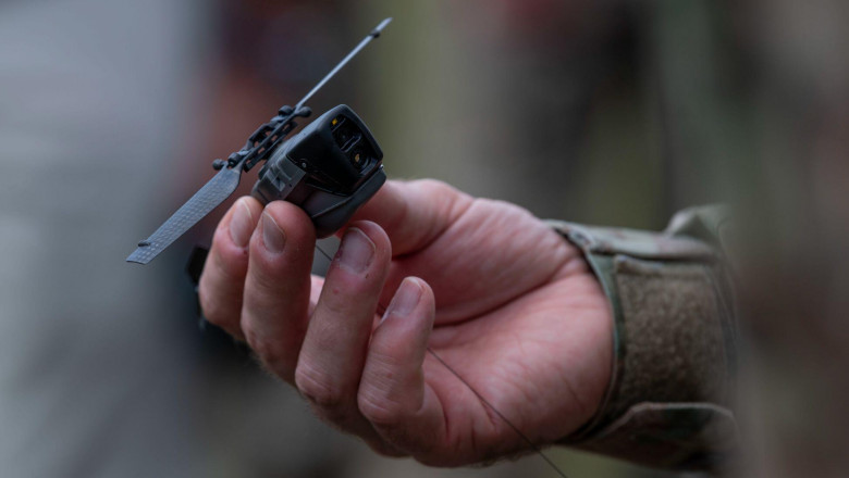 A black hornet nano unmanned aerial vehicle is displayed during the Air Force Special Operations Command Technology, Acquisition, and Sustainment Review at Austere Field #6, Florida, July 21, 2021. AFSOC provides high-return on investment capabilities acr