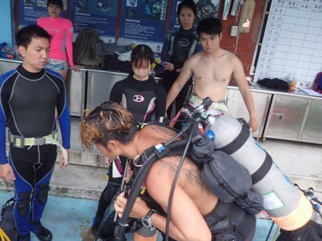 Divers swim with huge eathquake-heralding oarfish with bizarre holes in its body