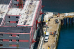 PORTLAND, ENGLAND JUL 20 2023: Detail of Bibby Stockholm barge from above docked on land after arriving the day before. Being prepared to house 500