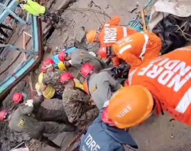 EXCLUSIVE: VIDEO: 16 dead and five injured as construction crane collapses – with more 'trapped beneath debris'