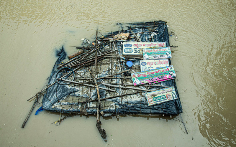 Flood in New Delhi, India Facing the Deluge: A humble hut constructed with plastic sheets and sticks finds itself submer