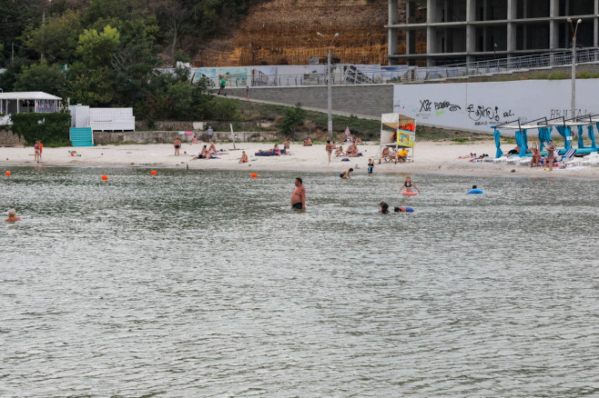 Vacationers Enjoy The Beach - Odesa