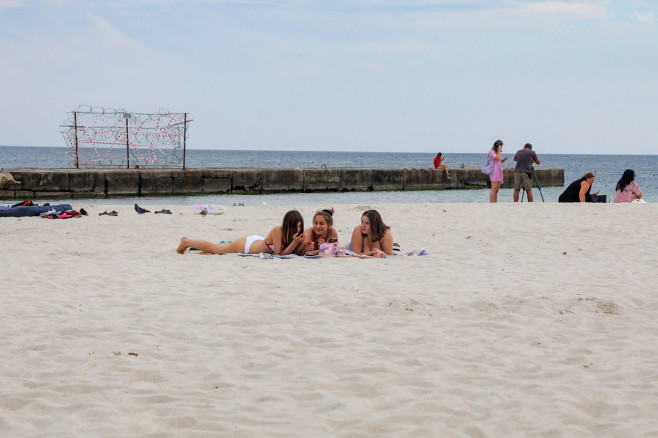 Vacationers Enjoy The Beach - Odesa