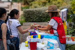 Madrid, Spain. 16th Aug, 2023. A woman receives baby food donated by Fundacion Madrina. Fundacion Madrina is providing fans to vulnerable children and mothers, to cope with the high temperatures and heat waves during the summer, as well as providing food