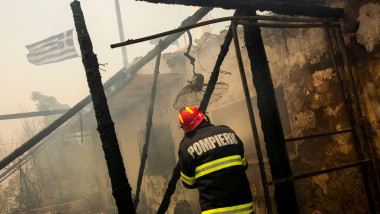 Gennadi, Greece. 24th July, 2023. Romanian firefighters try to extinguish a fire that broke out in a house near the village of Gennadi. Forest fires rage in Rhodes and other parts of Greece. Credit: Socrates Baltagiannis/dpa/Alamy Live News