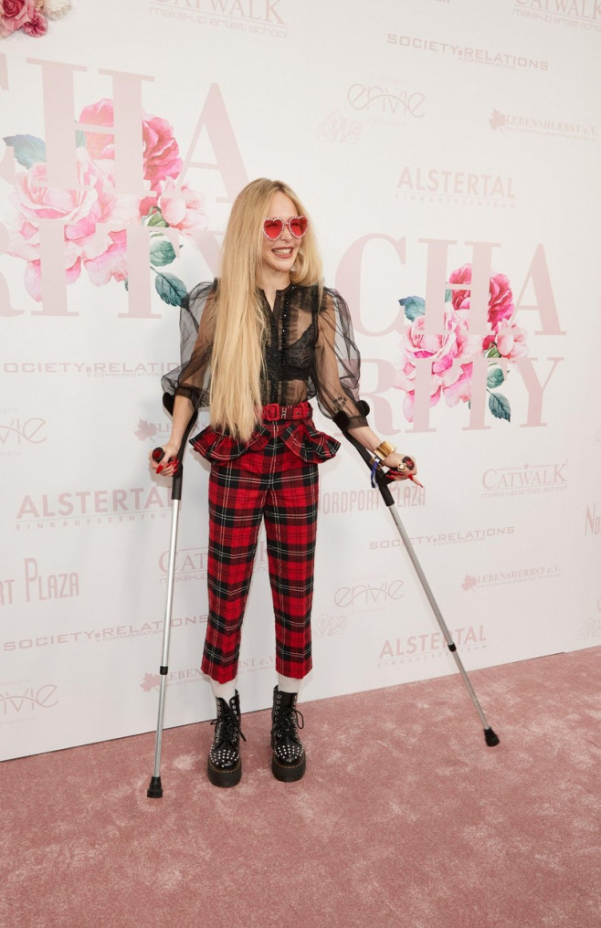Hamburg, Germany. 03rd Apr, 2022. Theresia Fischer, model, comes with crutches, to the Alstertal Shopping Center on the occasion of the benefit event in favor of the Lebensherbst association. Half of the proceeds will go to the association, which cares fo