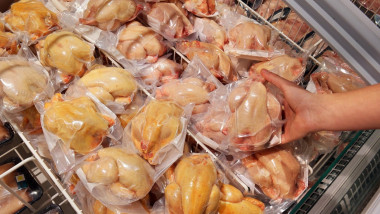 Poultry, deep frozen plucked Quail packings in a supermarket.