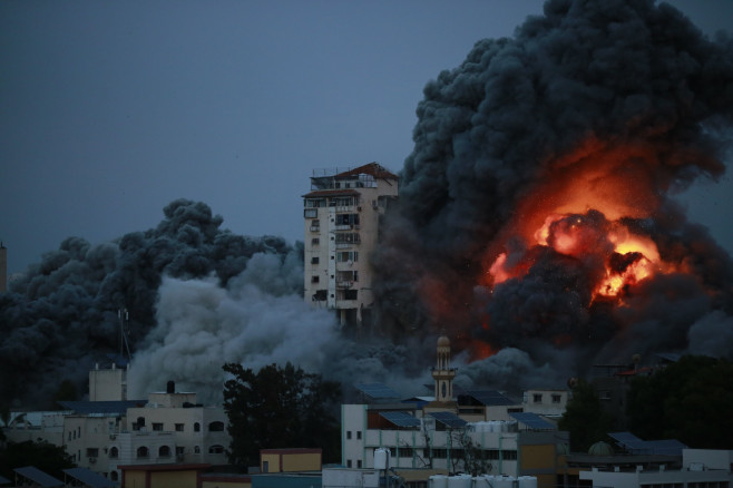 Smoke and flames billow after Israeli forces struck a high-rise tower in Gaza City, Gaza city, Gaza Strip, Palestinian Territory - 07 Oct 2023