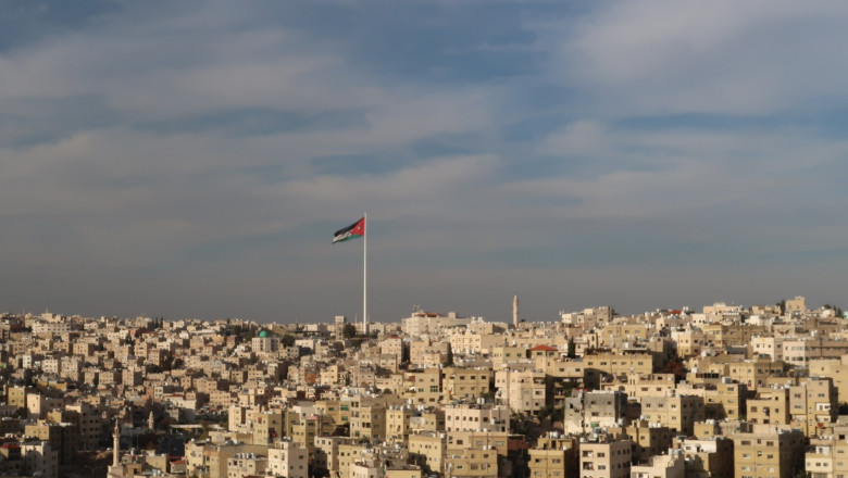 Jordanian Flag over the skyline of Amman, Jordan