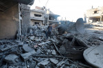 People are seen around destroyed buildings and debris at Dair El_Balah City, after an Israeli airstrikes that has been going on for Nine days in Gaza People are seen around destroyed buildings and debris at Dair El_Balah City, after an Israeli airstrikes