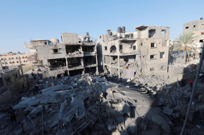 People are seen around destroyed buildings and debris at Dair El_Balah City, after an Israeli airstrikes that has been going on for Nine days in Gaza People are seen around destroyed buildings and debris at Dair El_Balah City, after an Israeli airstrikes