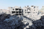 People are seen around destroyed buildings and debris at Dair El_Balah City, after an Israeli airstrikes that has been going on for Nine days in Gaza People are seen around destroyed buildings and debris at Dair El_Balah City, after an Israeli airstrikes