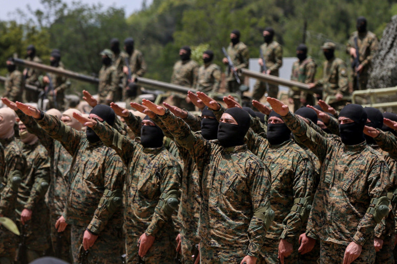 Aramta, Lebanon. 21st May, 2023. Pro-Iranian Hezbollah fighters take the oath during a staged military exercise in a camp in the Lebanese southern village of Aramta. The show came ahead of the 23rd "Liberation Day", the annual celebration of the withdrawa