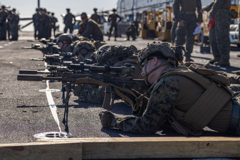 U.S. Marines and Sailors with the 26th Marine Expeditionary Unit (Special Operations Capable) (MEU(SOC)), conduct a battle-sight zero (BZO) during a range aboard the Wasp-class amphibious assault ship USS Bataan (LHD 5), Atlantic Ocean, July 27, 2023. A B