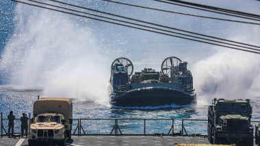 230725-N-ED646-1039- ATLANTIC OCEAN (July 25, 2023) A landing craft, air cushion (LCAC), assigned to Assault Craft Unit 4, transits toward the well deck of the amphibious dock landing ship USS Carter Hall (LSD 50). The Bataan Amphibious Ready Group is cur