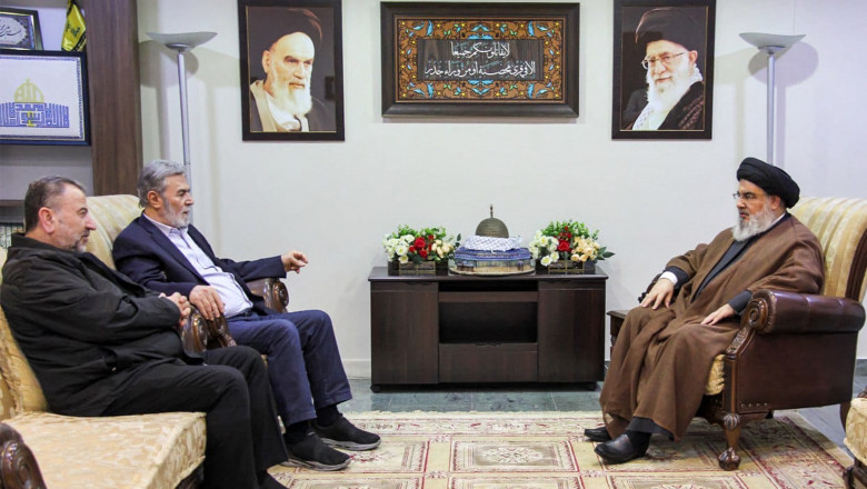 Hezbollah secretary-general Hassan Nasrallah (R) meeting with with the Palestinian secretary-general of the Islamic Jihad movement Ziad Nakhale (2nd-L) and the Hamas movement's deputy chief of political affairs Saleh al-Arouri (L) at an undisclosed location in Lebanon