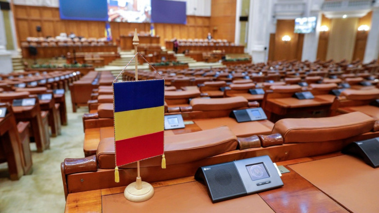Bucharest, Romania - November 14, 2022: Romanian flag and empty seats in the Romanian Chamber of Deputies inside the Palace of Parliament.