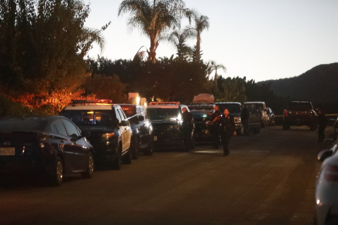 Views of the police outside of Matthew Perry's house after he was found dead in Pacific Palisades