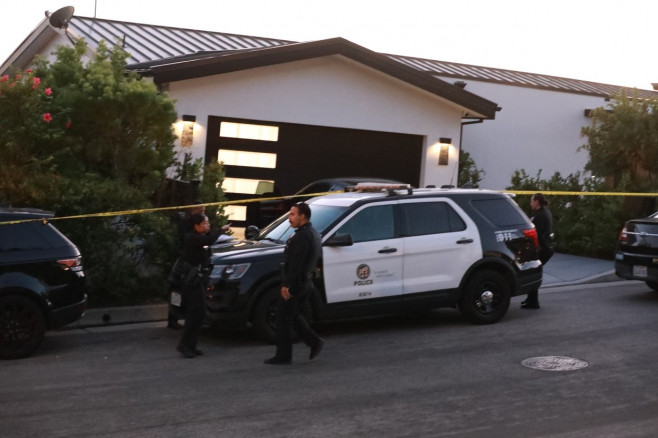 Views of the police outside of Matthew Perry's house after he was found dead in Pacific Palisades